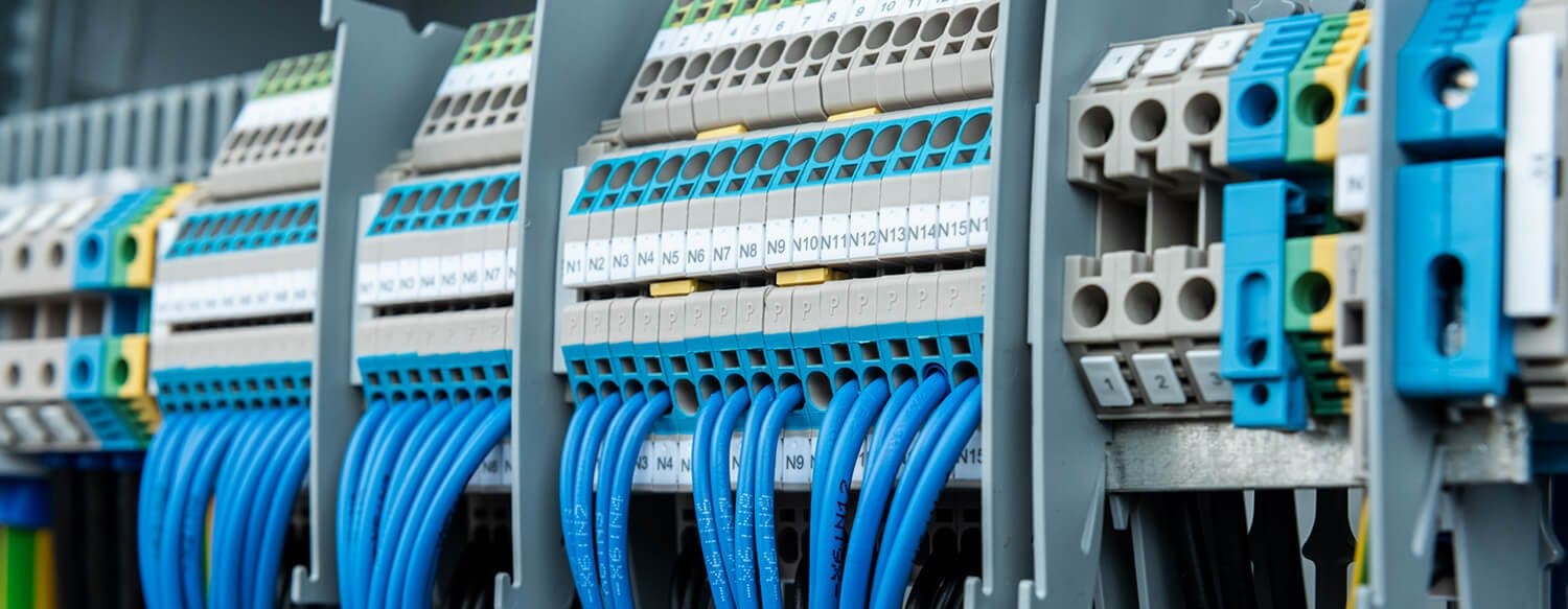 Terminal blocks and wired plug-in modules inside the control panel